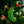 Load image into Gallery viewer, Green Christmas ornament shaped like a candy cane hanging on a tree with blurred lights in the background.
