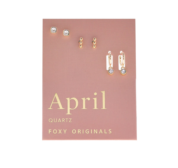 Set of earrings on a pink card with 'April Quartz' and 'Foxy Originals' text.