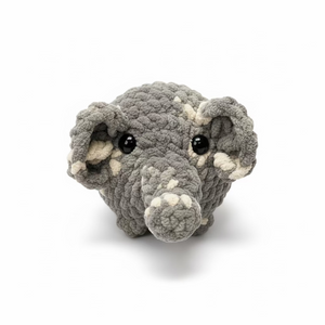 Gray plush toy resembling a mouse on a white background