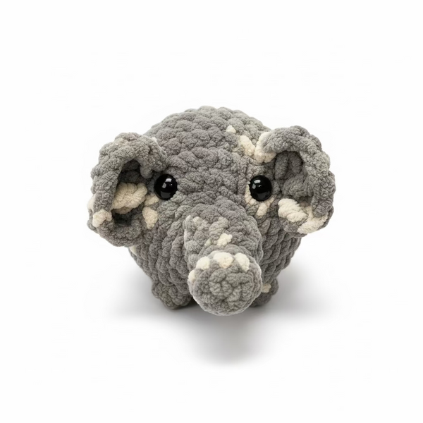 Gray plush toy resembling a mouse on a white background